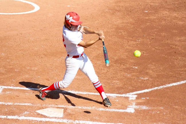 Valerie Macias rips a triple with the bases loaded against South Mountain in game one. (photo by Aaron Webster)