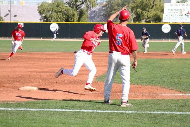 Mesa Head Coach, Tony Cirelli, sends home a couple T-Bird base-runners on a triple from Riley Peterson. (Photo by Aaron Webster)