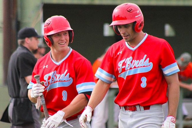 Pauly Steffenson and Kelby Richardson share a laugh after Richardson scored in the second inning. (Photo by Aaron Webster)
