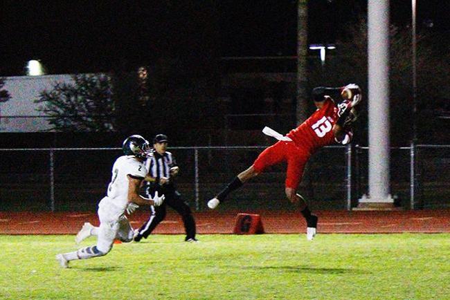 Aaron Molina(#13) hauls in a 34 yard touchdown in the second half against Scottsdale (Photo by Jacob Dewald)