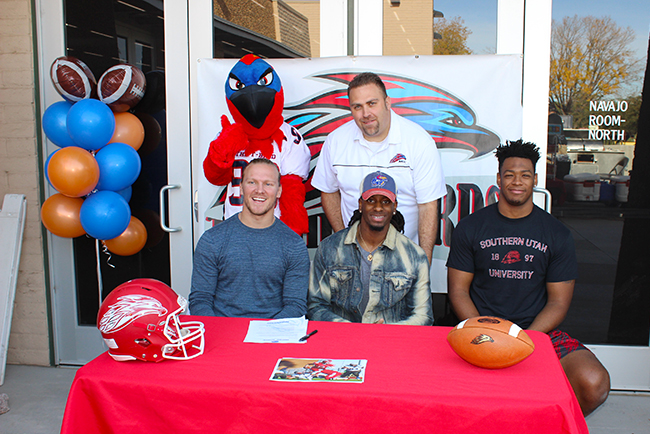 Rathen Ricedorff (left) signed with Boise State.  Shak Taylor (middle) signed with Kansas and Marquez Tucker (right) signed with Southern Utah. (photo by Aaron Webster)