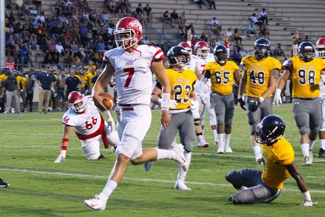 Mesa quarterback, Thomas MacVittie (#7), runs in the T-Birds first touchdown of the season in the first quarter at Phoenix College Saturday night. MacVittie accounted for two rushing and two passing touchdowns for the T-Birds. (Photo by Aaron Webster)