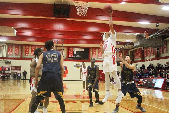 Mesa's Ramon Franklin (#10) powers up two of his 17 points on the night. (Photo by Aaron Webster)