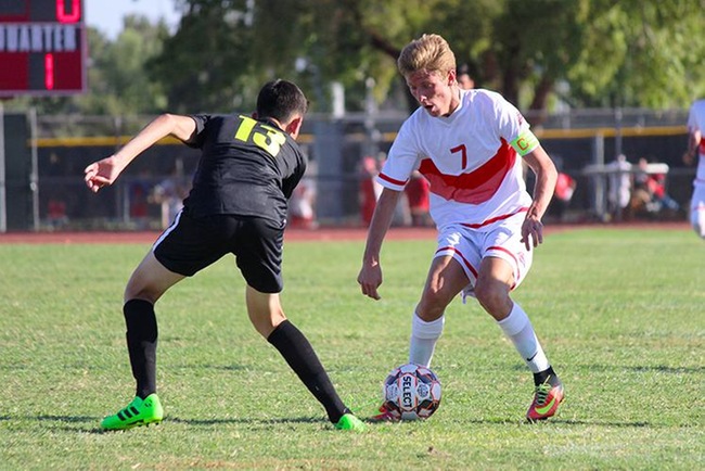 Mesa's Danny Baca (#7) attacks a Gateway defender Tuesday afternoon in Mesa's 5-0 win over the Geckos.  Baca recorded a hat trick in the victory. (Photo by Aaron Webster)