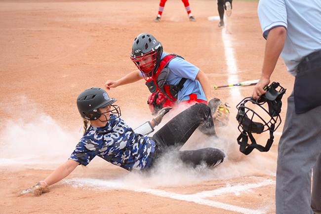 Mesa's catcher, Tori Gonzalez, tags out a would be South Mountain run Saturday afternoon. (photo by Aaron Webster)