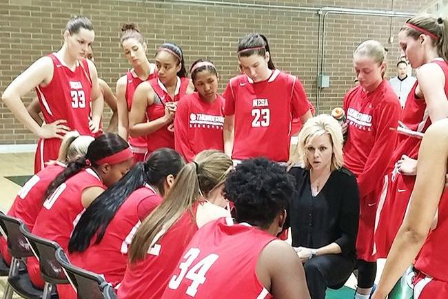 Coach Stephenson talks to her team during a timeout(photo by Aaron Webster)