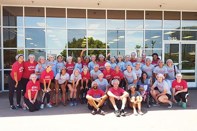 Women's soccer and volleyball volunteered at Feed My Starving Children, helping pack food boxes for children in India