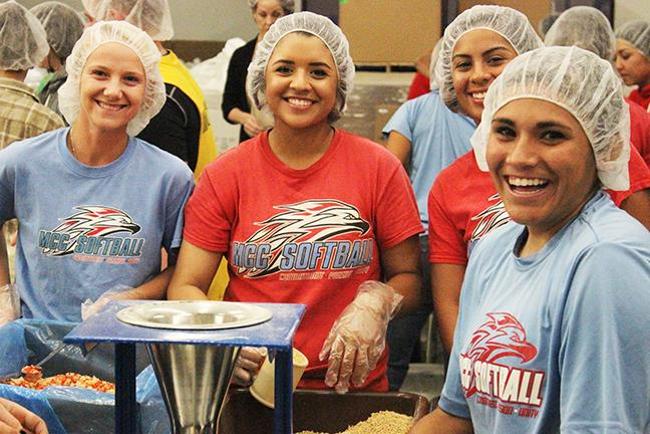 (Left to Right) Bridget Kruck, Mariah Gonzalez, Nikki Verdugo and Alina Lopez happily pack food for Feed My Starving Children(photo by Aaron Webster)