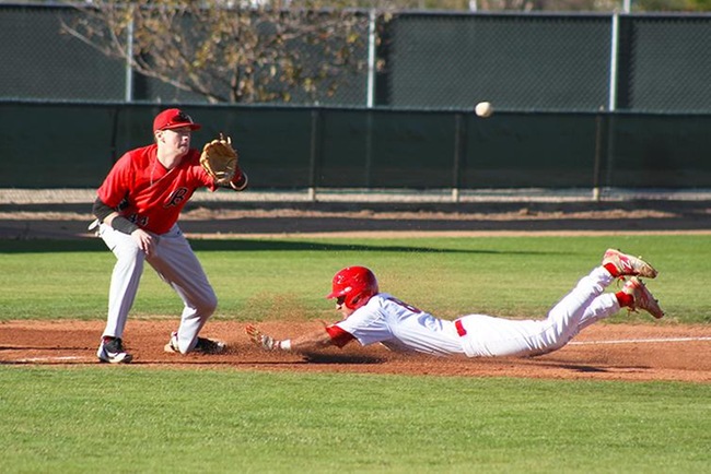 Esteban Martinez slides safely into third after roping a line drive down the right field line that scored Mesa's first run of the season. (photo by Aaron Webster)
