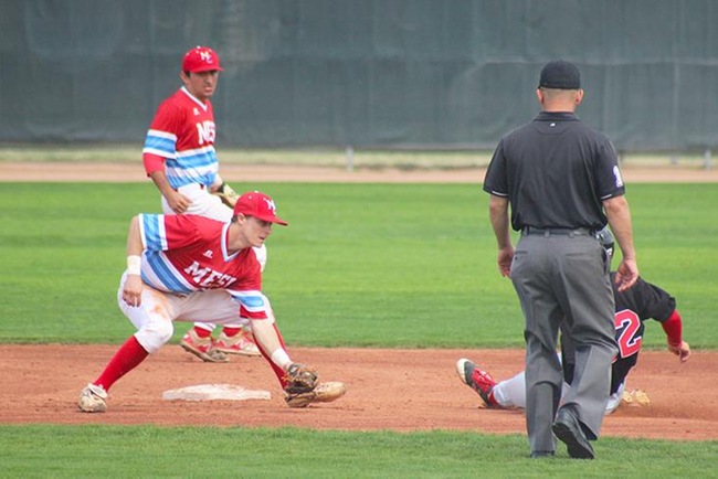 Mesa's Garrett Smith tags out a would be base stealer. (photo by Aaron Webster)