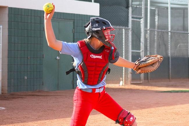 Mesa catcher, Tori Gonzalez, looks to throw a runner out at second base. (photo by Aaron Webster)