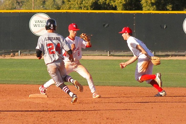 Mesa second baseman Connor Denning flips it to short stop Corey Chaplin for a third out Friday afternoon. (Photo by one of the trainers)