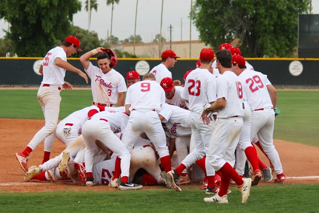 The T-Birds dog-pile after beating Central Arizona, 3-2, in the bottom of the ninth inning.