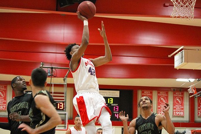 Adonis Arms takes it to the hoop against Scottsdale Saturday night. (photo by Aaron Webster)