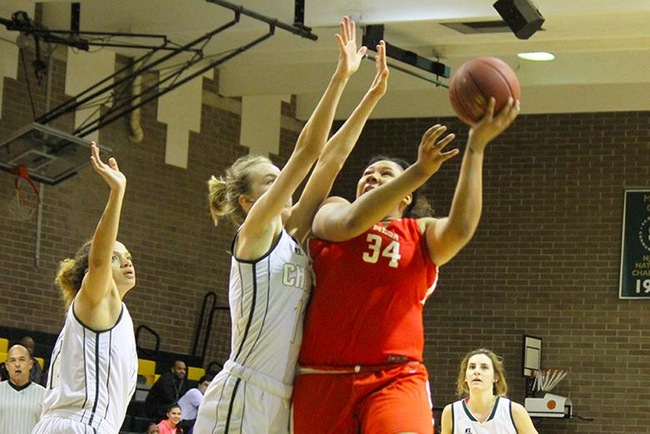 Paige Nealey (#34) scores two of her six points over Scottsdale defenders Wednesday night. (photo by Aaron Webster)