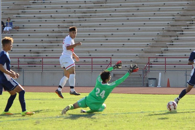 Mesa's Moses Durazo heads one into the goal over the Paradise Valley goalkeeper in Tuesday's 5-1 victory. (Photo by Aaron Webster)