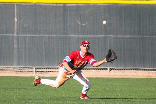 Hunter Bross makes a diving grab to take away a hit from Paradise Valley Tuesday afternoon. (photo by Aaron Webster)