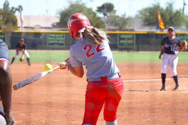 Ryann Holmes crushes a home run Friday morning against Paradise Valley. (Photo by Aaron Webster)