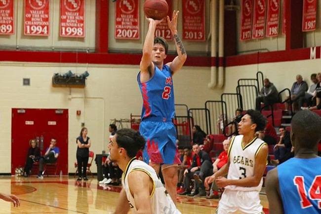 Mesa's Kyle Fischer shoots a jumper in Saturday's game against Phoenix College. (Photo by Aaron Webster)