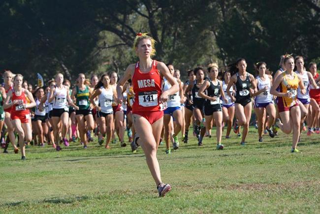 Allyson Girard leads the pack at the sound of the opening gun as she had a top 30 finish with 18:05 finish.